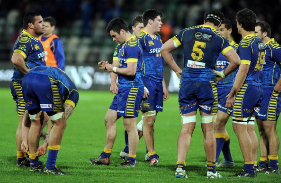Dejected Otago players on the field following their 41-0 loss to Hawkes Bay in Napier on Sunday. ...