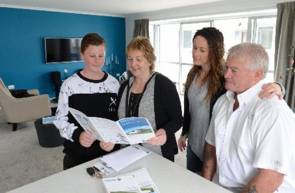 Delighted with their newly acquired home are (from left) Zac Schofield (13) and his grandmother...