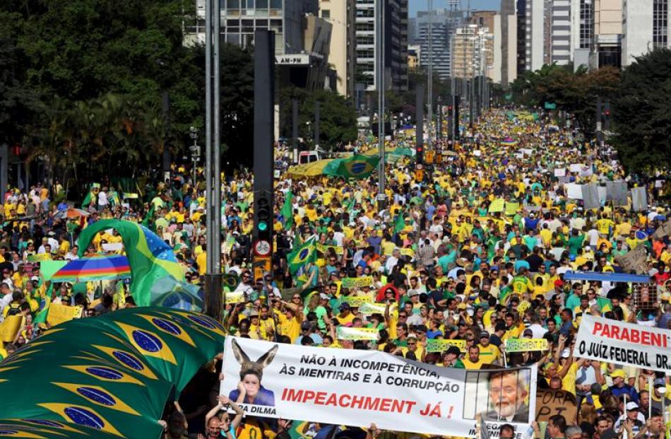 Demonstrators attend a protest in Sao Paulo's financial centre against Brazil's President Dilma...