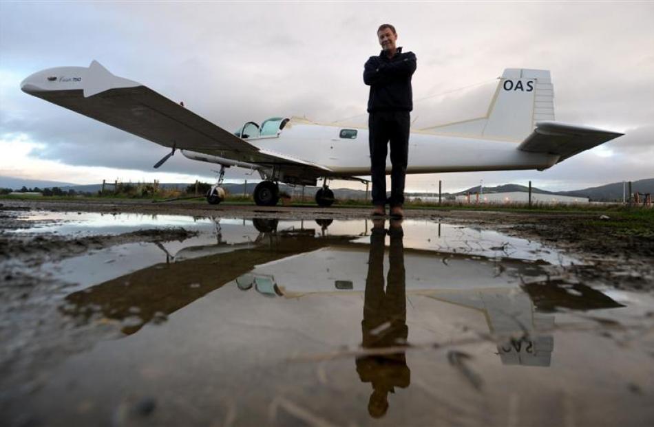 Des Neill, of Otago Airspread, with his Cresco aircraft which has recently been converted to an...