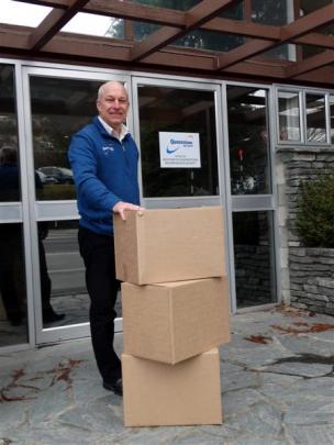 Destination Queenstown boss Graham Budd packs up ahead of a move to new premises. Photo by Louise...