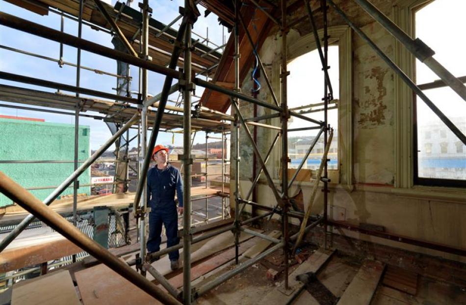 Developer Lawrie Forbes examines  the Reed's Building,  which he saved from demolition. Photos by...