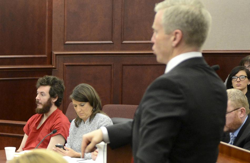 District Attorney George Brauchler addresses the court during the trial of James Holmes (left)....