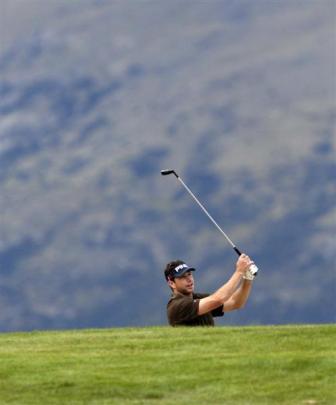 DJ Brigman plays a shot on the 18th hole yesterday. Photo by Gregor Richardson.