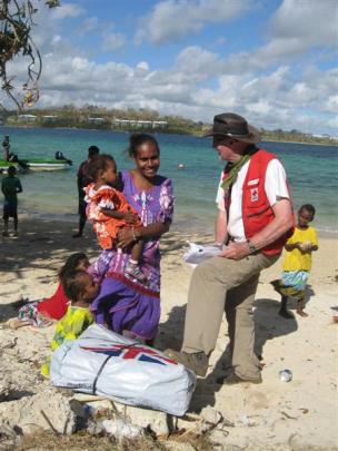 Douglas Clark distributes aid in Vanuatu following Cyclone Pam. Photos supplied.
