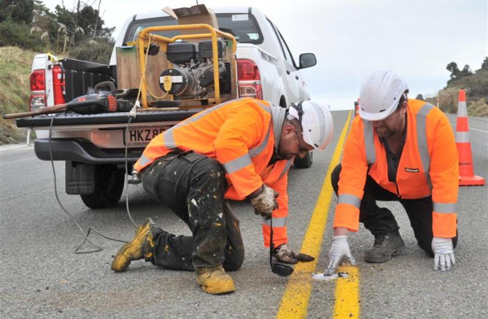 Downer line marking technician Anthony McKenzie and hybrid maintenance supervisor Shane Wilde...