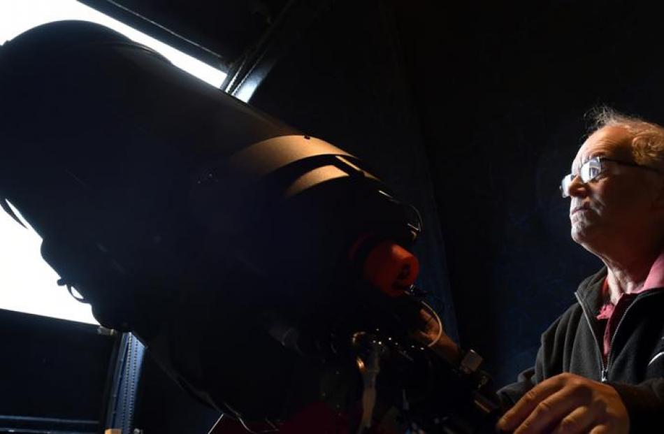 Dunedin amateur astronomer Ash Pennell looks at a 35cm telescope at the Beverly-Begg Observatory...