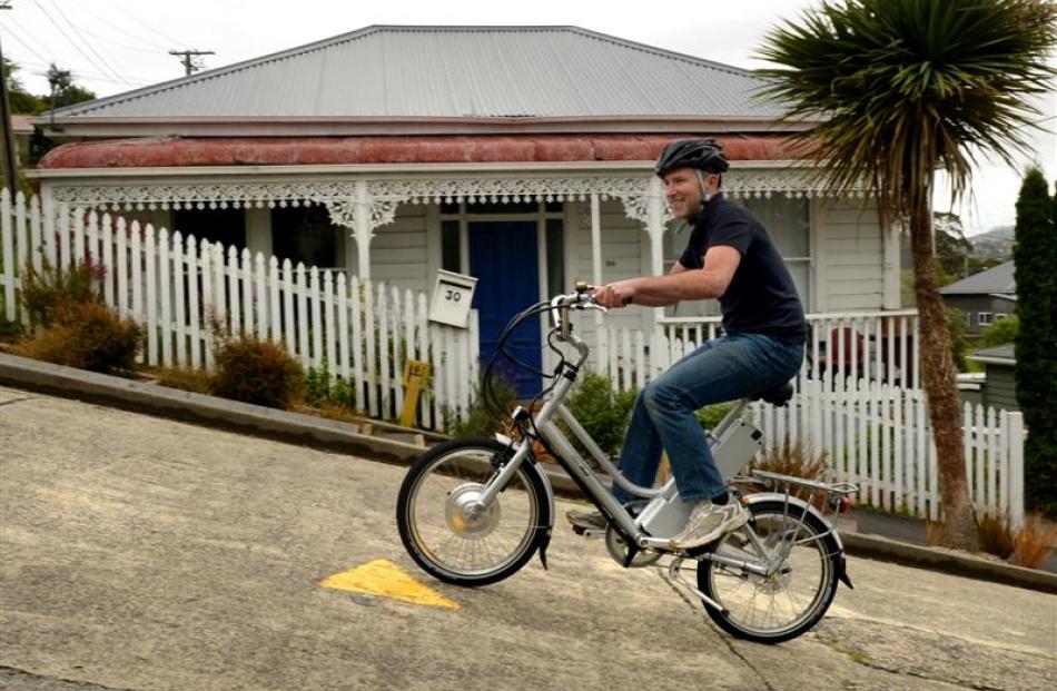 Dunedin AvantiPlus bike mechanic Mac Robertson tests the eZee electric bike up Baldwin St in...