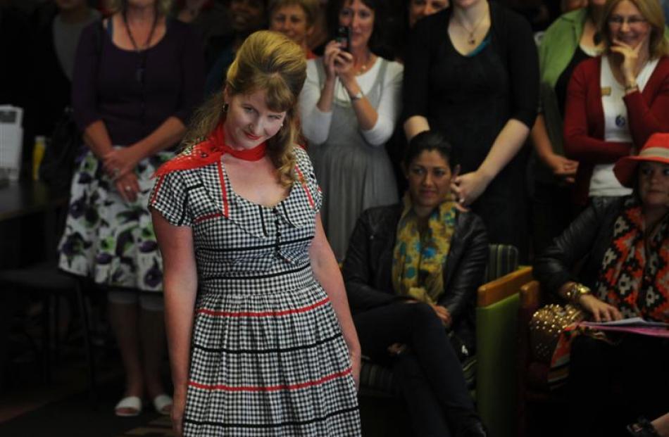 Dunedin Central Library staff member Emma Milburn (top) models a vintage dress during the geek...