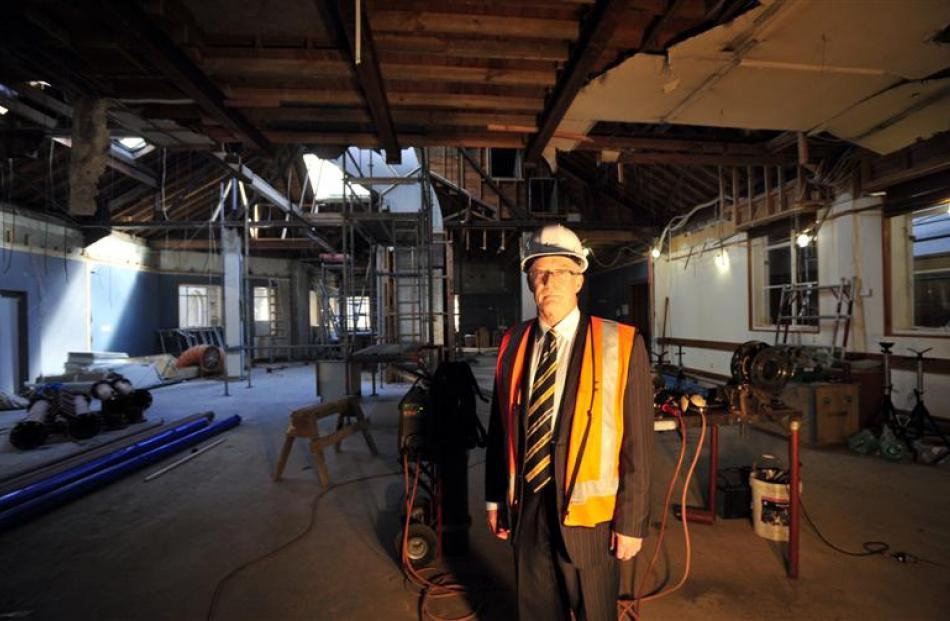 Dunedin City Council city property manager Robert Clark surveys work under way inside the...