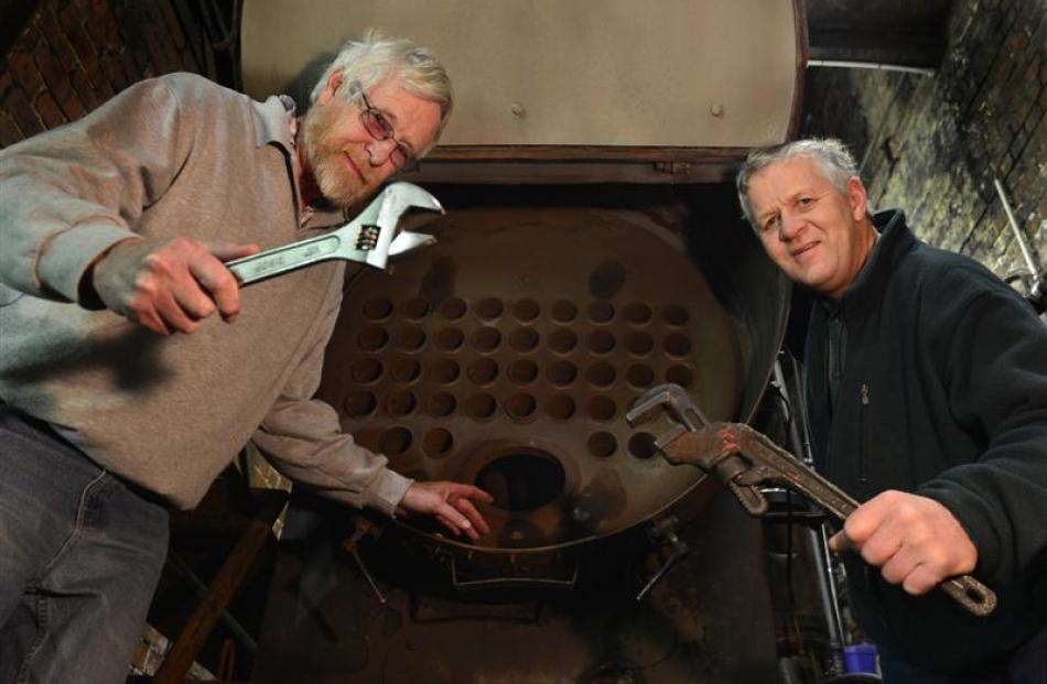 Dunedin Gasworks Museum trustees John Heaven (left) and Tom Galletly examine the gasworks' boiler...