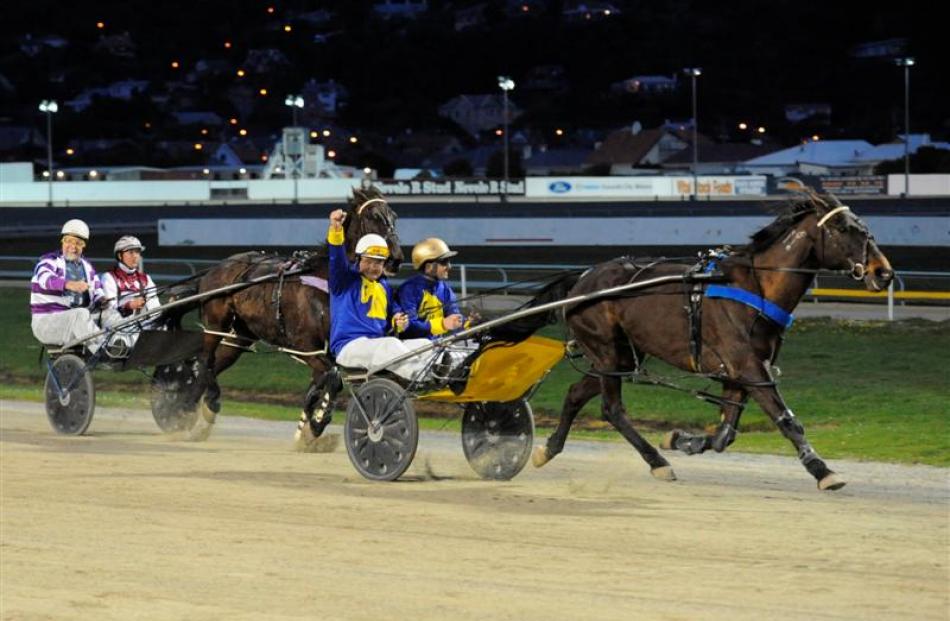 Dunedin Mayor Dave Cull raises his arm in victory as he and Mattie Williamson driving Sonny...