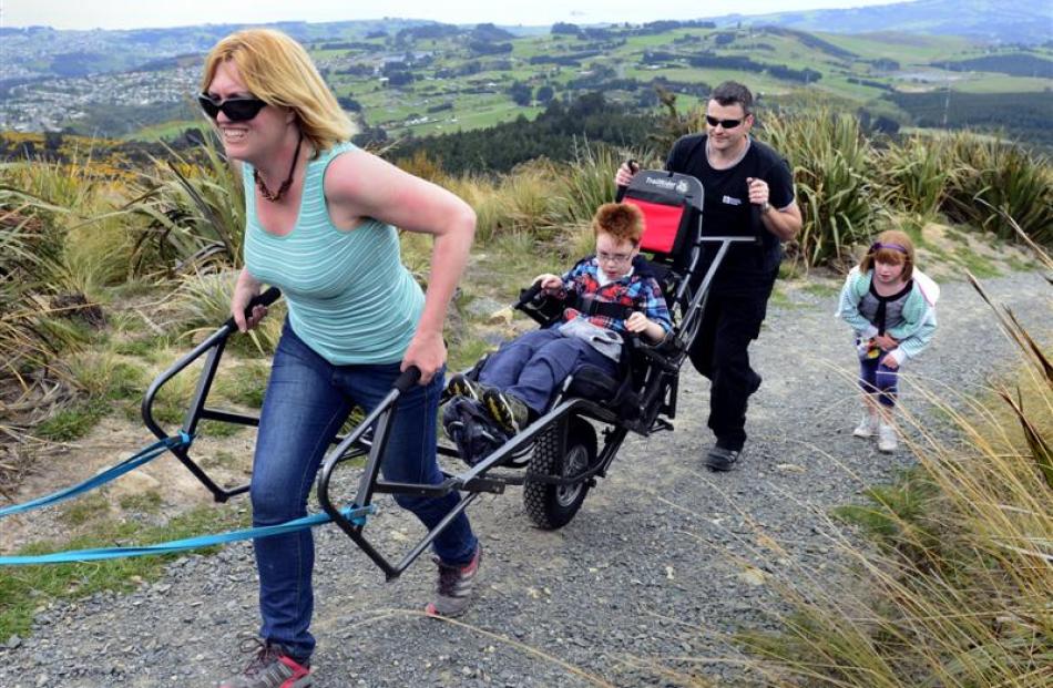 Dunedin mother Claire Casey navigates son Finn  (9) up the Pineapple Track in the new TrailRider...