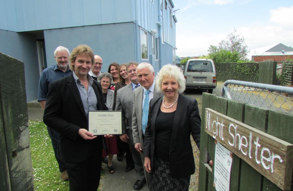 Dunedin Night Shelter Trust members welcome representatives of Dunedin Law firm Wilkinson Rodgers...