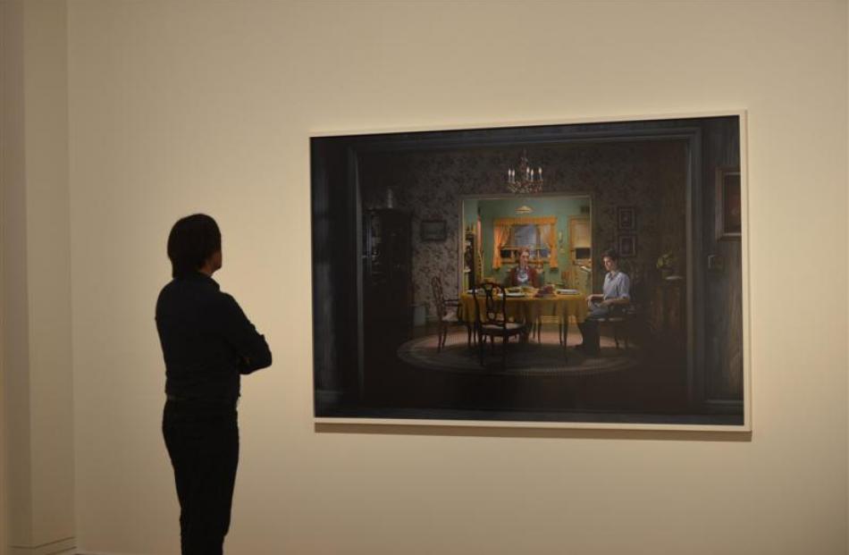 Dunedin Public Art Gallery commercial development manager Tim Pollock with a work from American...