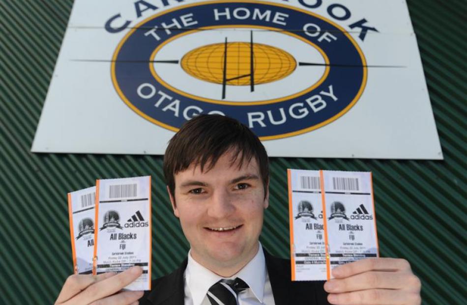 Dunedin resident James Columb gets his tickets for the test between the All Blacks and Fiji at...