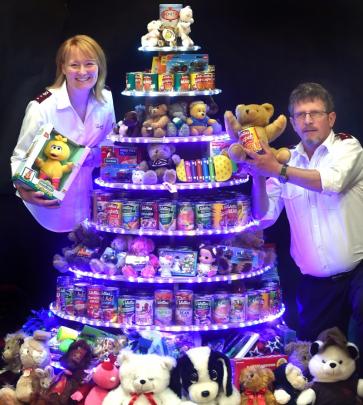 Dunedin Salvation Army corps captains Andrew and Rochelle Moffatt at the Farmlands Christmas tree...