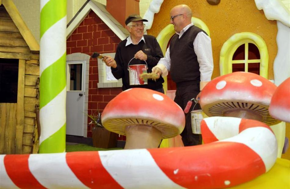 Dunedin Santa Parade volunteer Warren Ockwell (left) and chairman Dean Driver put the finishing...