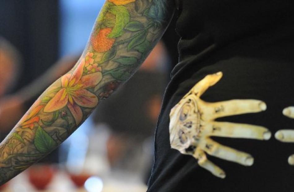 Dunedin Tattoo and Art Show  organiser Macaela Manuel displays some floral work at Forbury Park...