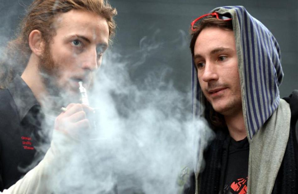 Dunedin 'vapers' Shaye Kirk (left) and Owen Butler use vaporisers as an alternative to smoking...