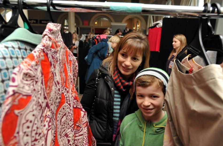 Dunedin woman Rebecca Meikle and her  son Sam browse  through clothing racks at the iD Designer...