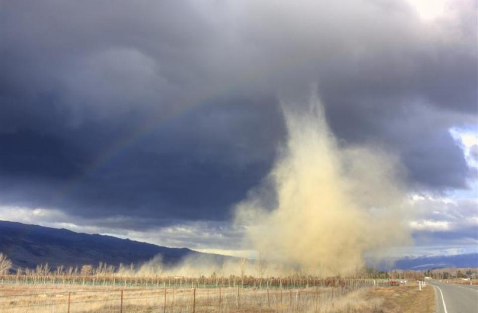 Dust flies from a storm photographed north of Cromwell yesterday. Photo by Julian Birchall.
