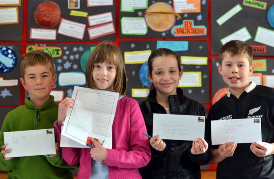 East Taieri School pupils (from left) Logan Hay (10), Kate McEwan (9), Holly Crawford (9) and...