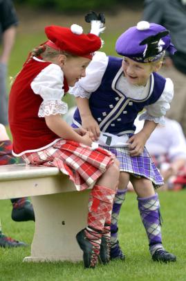 Eden Gilchrist (left) and Sarah Jamison share a secret as they wait to dance.