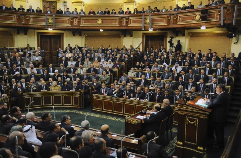 Egyptian President Mohamed Mursi delivers a speech to the Shura Council, or upper house of...