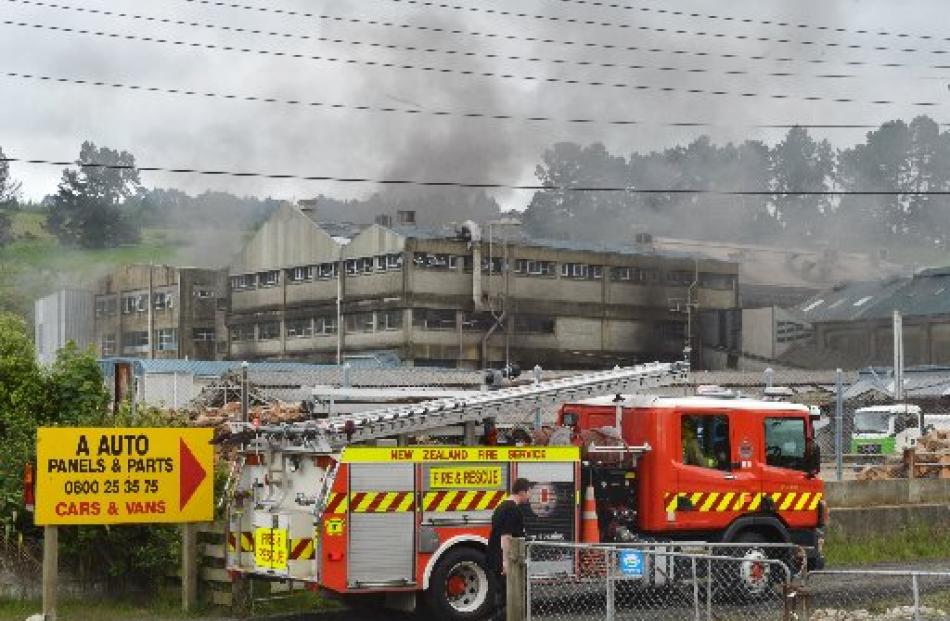 Eight fire crews rushed to the scene at the old Burnside freezing works. Photo by Gerard O'Brien