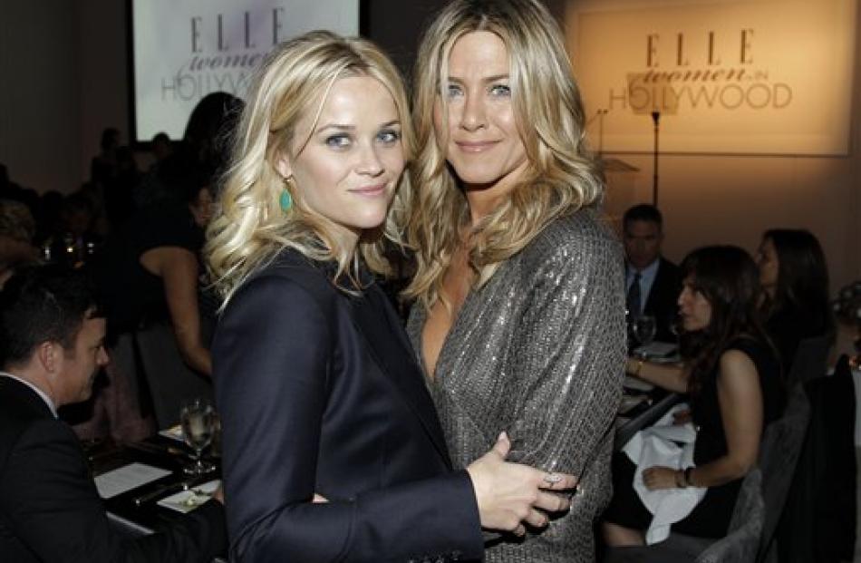 Jennifer Aniston, left, and Reese Witherspoon pose at the 18th Annual ELLE Women in Hollywood...