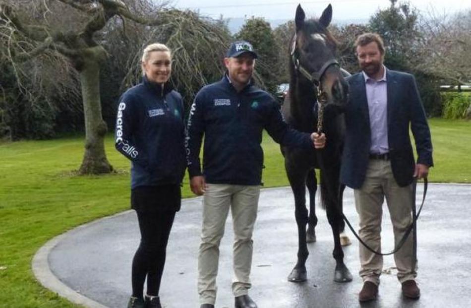 Ellissa and Brendon McCullum stand beside Sacred Falls and Waikato Stud general manager Mark...