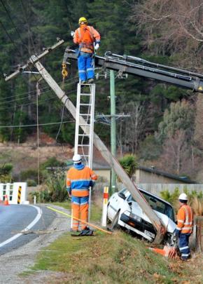 Emergency services  attend an accident in  Luggate  about 9.30am yesterday, where a car  slid on...