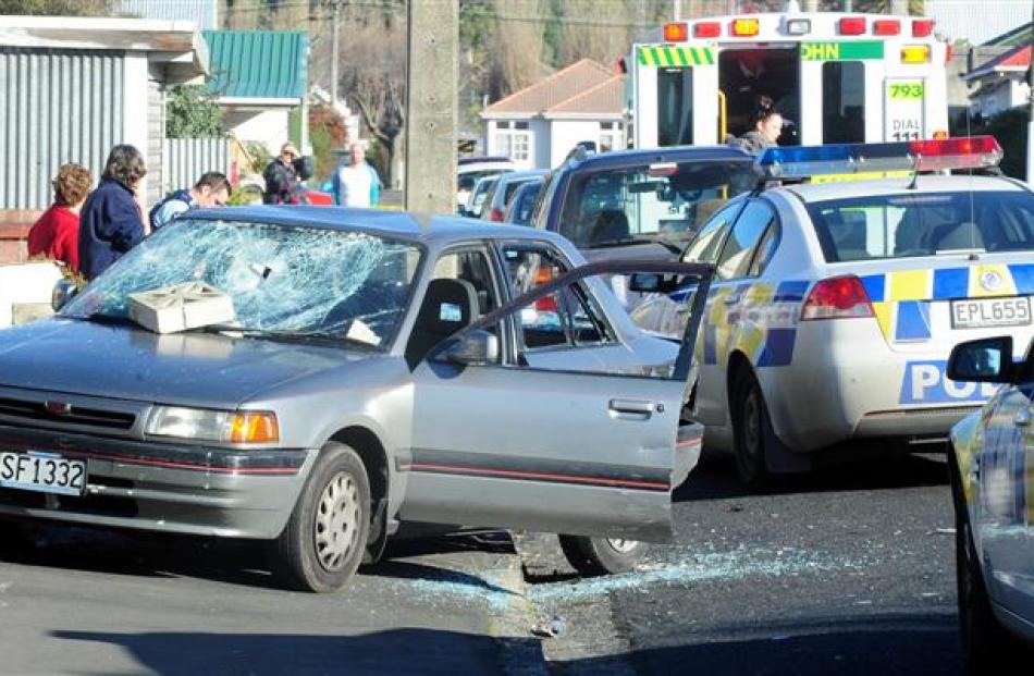 Emergency services attend an incident in which a car's windows were smashed and a man and woman...