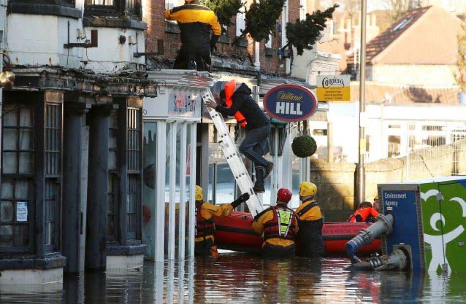 Emergency services rescue a group of people from a property in Tadcaster, northern England....