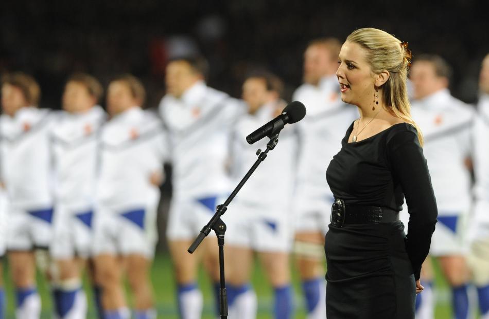 Emma Fraser sings the National France anthem during the Allblack France test match at Carisbrook....