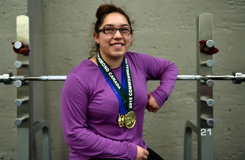 Emma Takapi at Absolute Health & Fitness yesterday with the four gold medals she won at the...