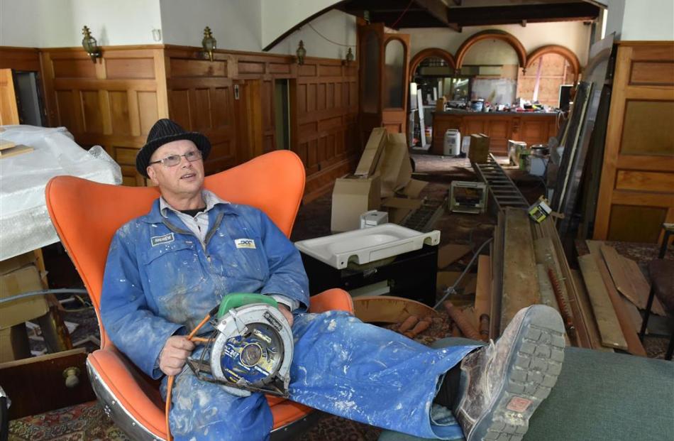 Empire Hotel owner Jon Leng sits on stage in the first floor bar where the Dunedin Sound was born...