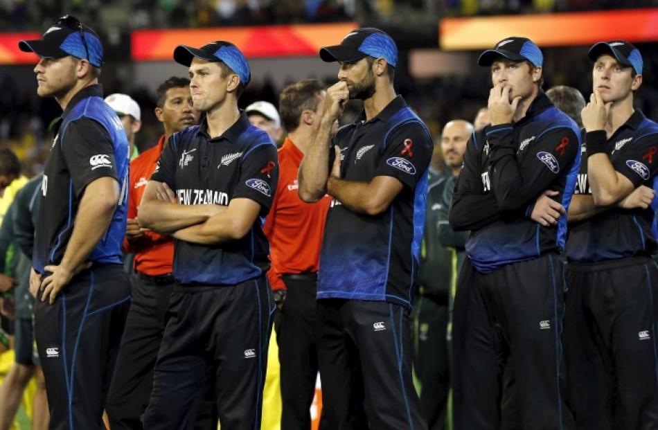 End of the dream . . . New Zealand players watch the presentation ceremony after their loss in...