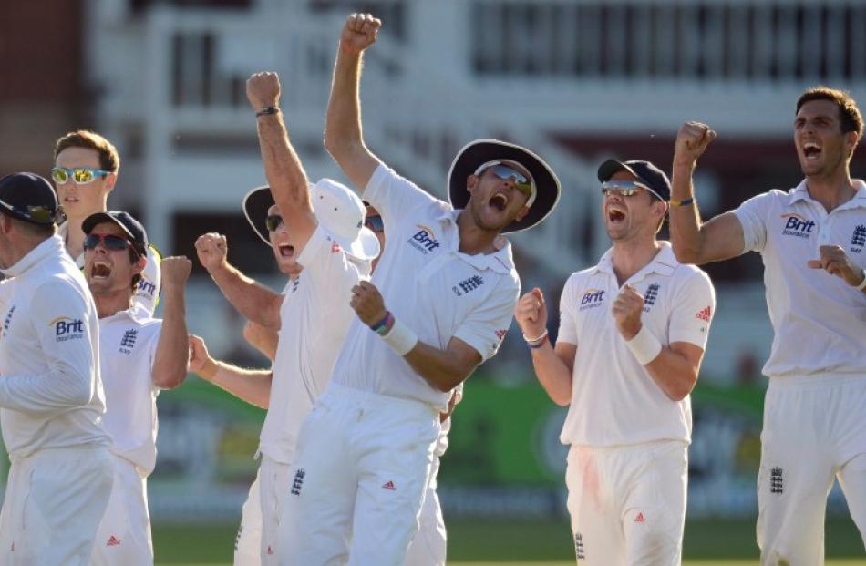 England players celebrate the dismissal of South Africa's Jacques Kallis during the third test at...