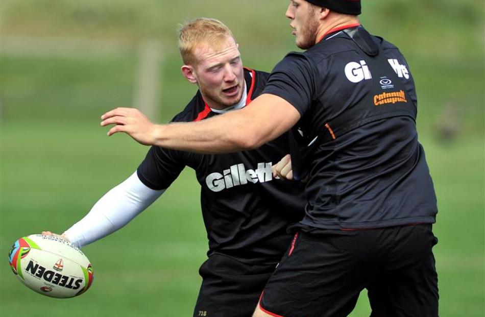 England rugby league international Liam Farrell tries to get the ball past fellow forward George...