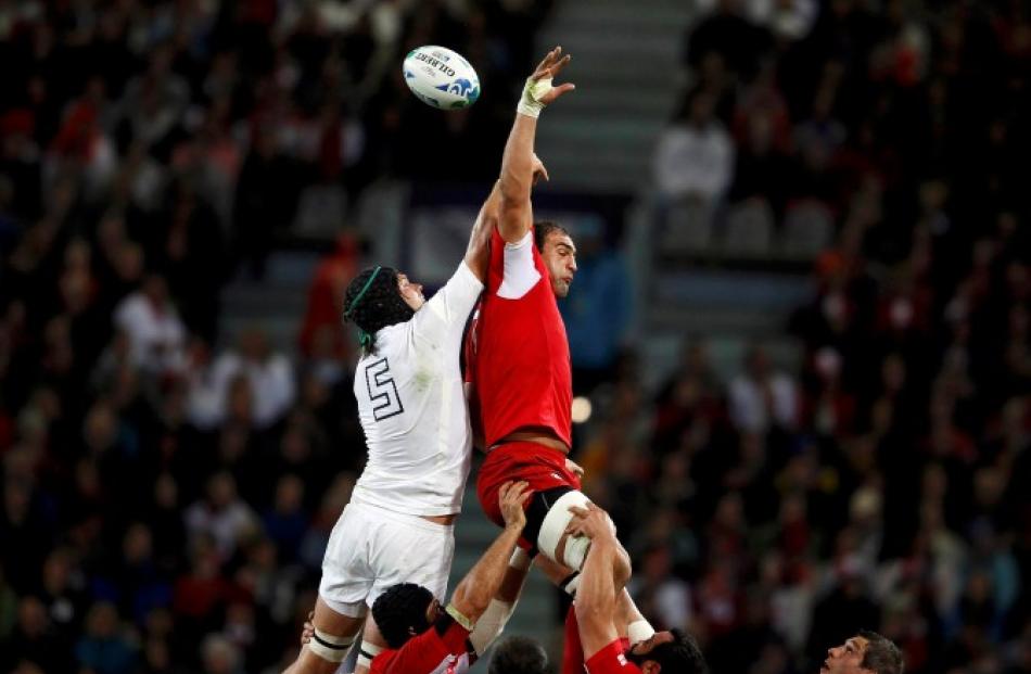 England's James Haskell (L) and Georgia's Dimitri Basilaia contest a lineout. Photo: REUTERS...