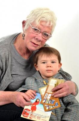 Erin Howard, of Dunedin, holds granddaughter Anika Boereboom (2) and the Malaysian lottery...