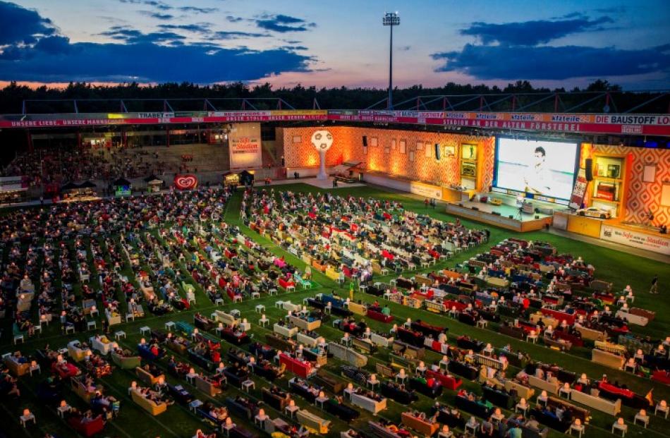 Fans watch the opening game of the 2014 World Cup between Brazil and Croatia, during a public...