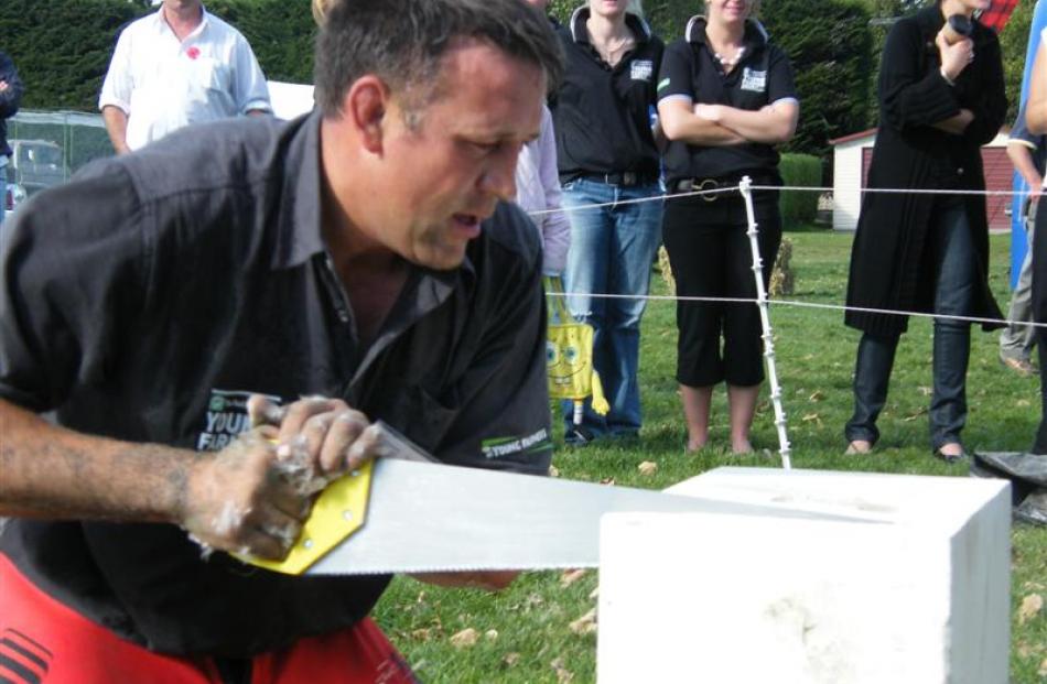 Mackenzie Young Farmers’ Club member Tim O’Sullivan saws a block of Oamaru stone to complete the...