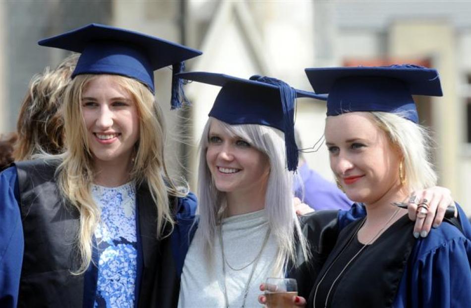 Fashion design graduates (from left) Margot Rieder, Jojo Ross and Tara Young are all smiles after...