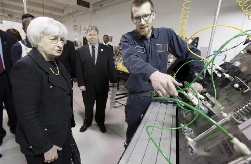 Federal Reserve chairwoman Janet Yellen speaks with student Baker Gregory as she tours the City...