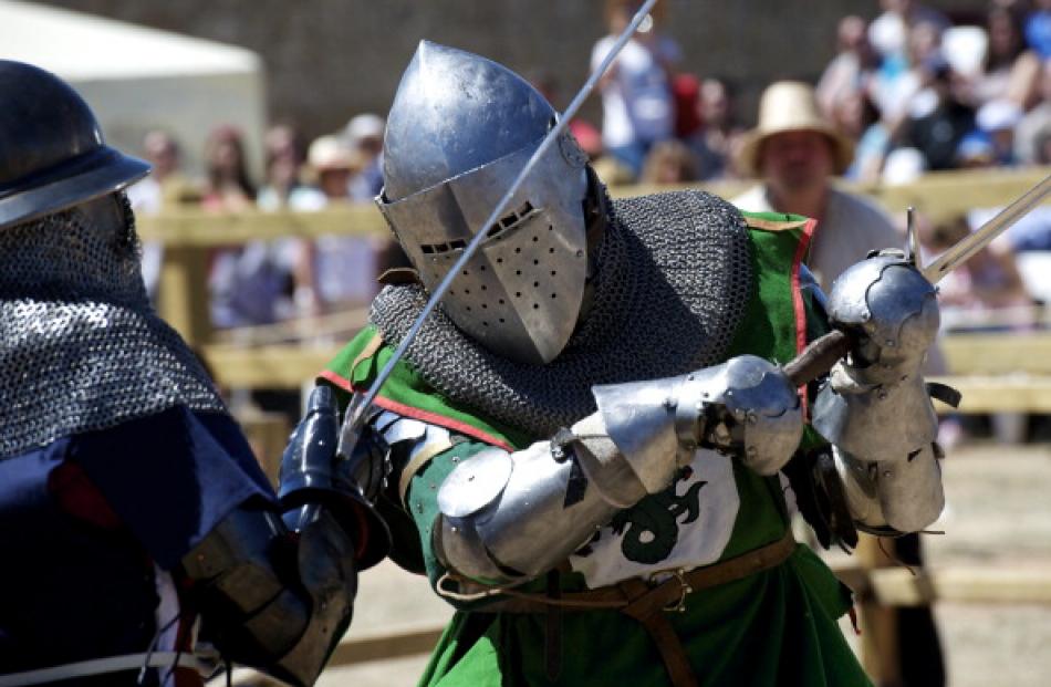 Female 'knights' from the US  (L) and Belgium battle during the International Medieval Combat at...