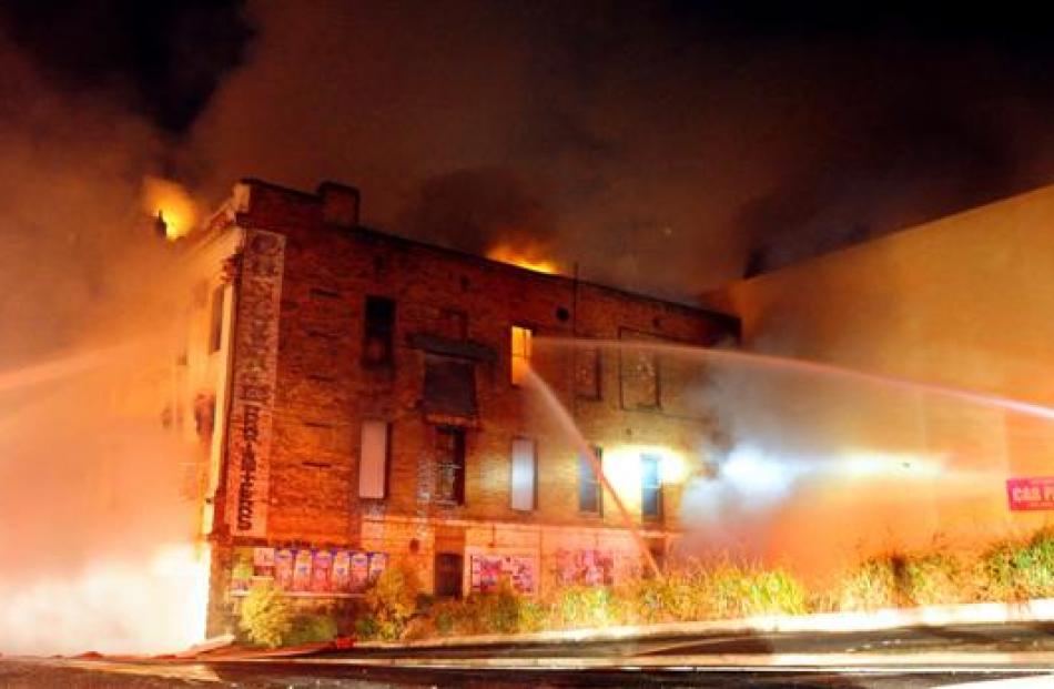 Firefighters attack the blaze in the Stavely Building from the outside about 4am yesterday after...
