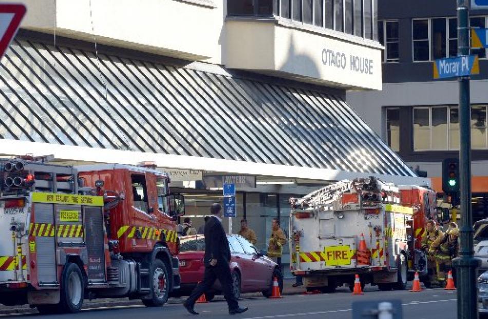 Firefighters in Moray Pl, Dunedin, yesterday after a fire alarm was activated. Photos by Stephen...